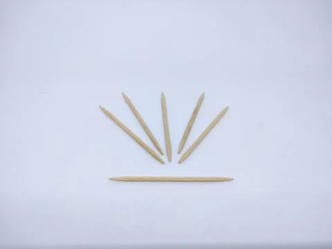 Close-Up Of Toothpick Against White Background Stock Photos