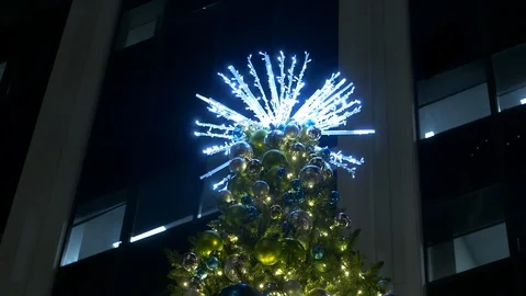 Close-up of top of Christmas tree at night Stock Footage 99805219