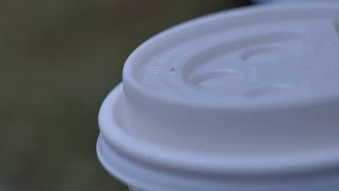 Close up on the top of a coffee cup lid 動画素材 121075998