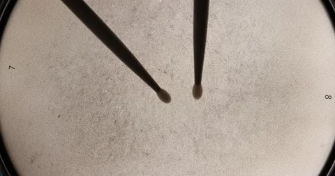 Close up top down view slow motion drumroll over backlit snare head Stock Footage 142016105