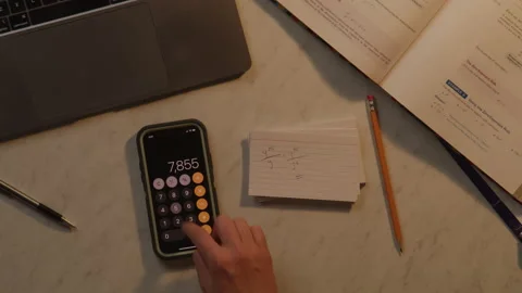 Close up Top Down View of Unknown Student Using Calculator to Solve Math Problem Stock Footage 217769303
