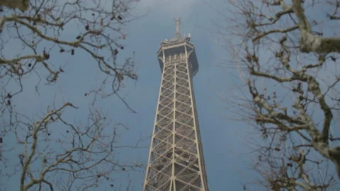 Close up top of the Eiffel tower, rack focus on elevator driving up, paris Stock Footage 236974097