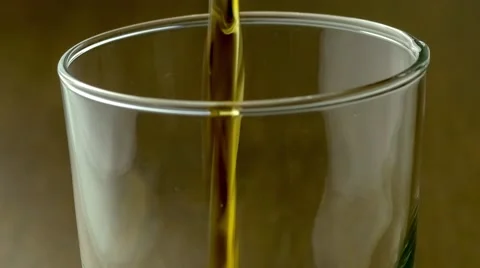 Close up of top half of drinking cup as it fills up with sweet caffeinated so Stock Footage 62760917