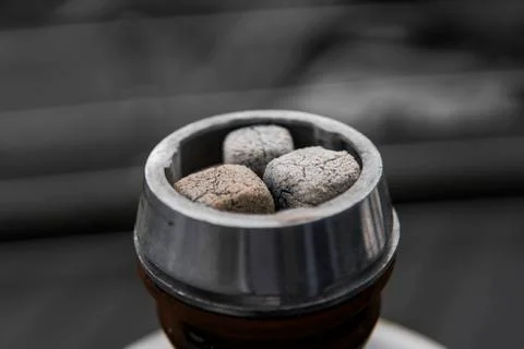 Close-up of a top of hookah with coconut coal. Stock Photos