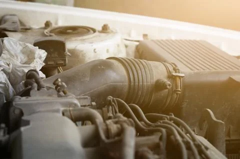 Close-up of the top of an old car engine. Dirty parts of an old engine. Repair Stock Photos