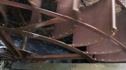 Close-up top perspective of a working watermill paddle wheel Stock Footage 196112213
