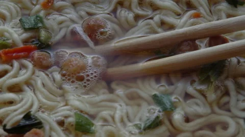 Close up of top ramen. Boiled instant noodle with Chinese chopsticks Stock Footage 149223387