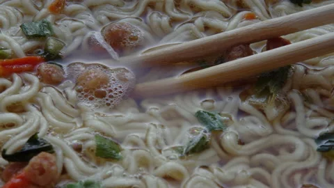 Close up of top ramen. Boiled instant noodle with Chinese chopsticks Stock Footage 149223794
