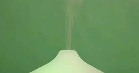 Close-up of the top of a scented oil diffuser humidifier exhaling scented mist Stock Footage 201268771