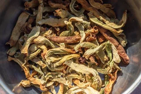 Close-up top shoot of string beans dried under the sunlight on the cook pot Stock Photos