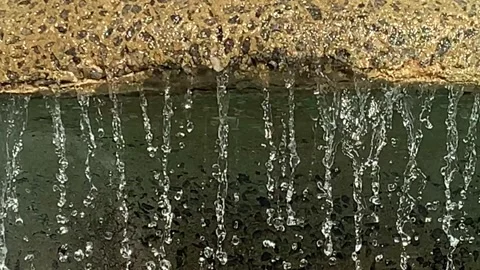 Close up of the top tier of a water feature fountain Stock Footage 165417385