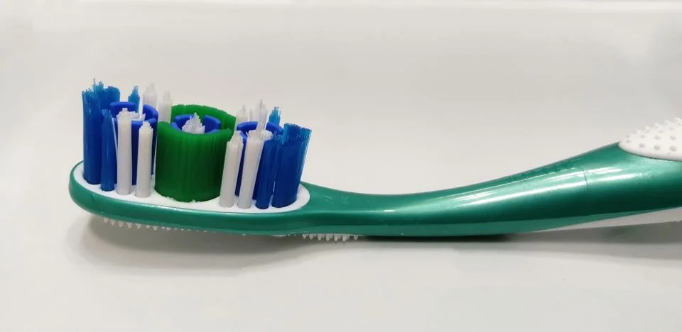 Close-up of the top of a toothbrush. Stock Photos