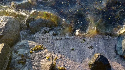 Close up top view of big white waves hitting sea rocks Stock Footage 156993694