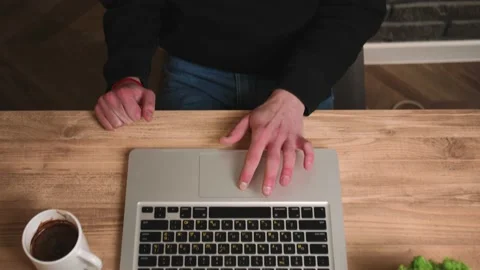 Close up. Top View. Caucasian man working on laptop. Man hands typing on laptop Stock Footage 148385581
