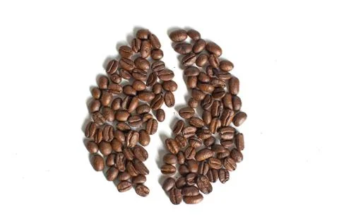 A close up top view of a coffee bean piled on a white background Foto stock