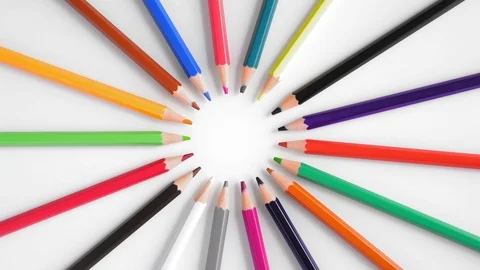 Close-up, Top View, Colored Pencils Lying in a Circle Rotate on White Background Stock Footage 112620090
