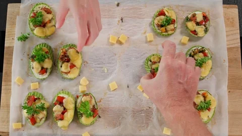 Close-up, top view, cooked zucchini stuffed with tomatoes, herbs and chees Stock Footage 270145786