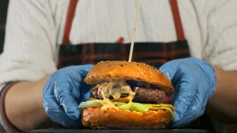 Close-up top view of a cook's hands cooking a hamburger. Stock Footage 119096070