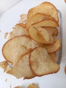 Close Up Top View of Crispy Cassava Chips in Glass Bowl Stock Photos