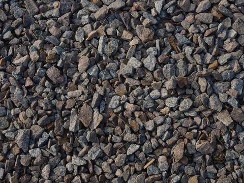 Close-up top view of detailed texture gravel and crushed stones, natural pa.. Stock Photos