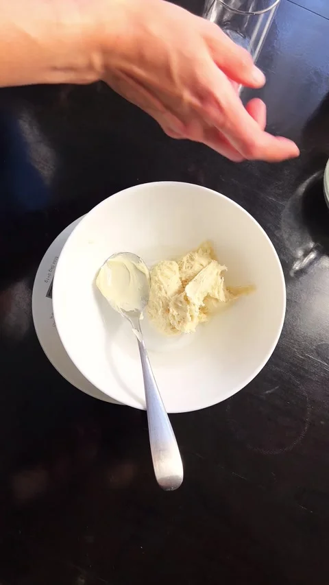 Close up top view footage of skilled hands blending flour and water Stock Footage 314597428