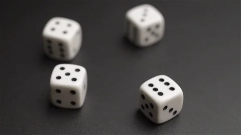 Close up top view of four dice rotating  on black background Stock Footage 71626100
