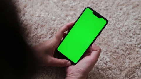 Close-Up Top View of Green Screen Phone in Female Hands at Home, while She Lying Stock Footage 194693118