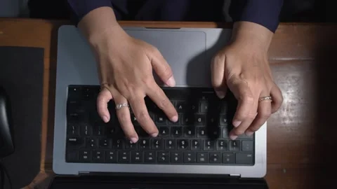 Close-up top view of hand typing using a laptop computer. Stock Footage 263568774