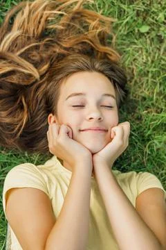 Close up top view high angle photo beautiful young girl child dreamily closed 库存照片