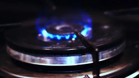 Close up top view of igniting a gas cooker with a bright blue flame Stock Footage 220005283