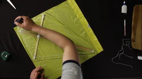 Close up Top View of Man Making a Kite Stock Footage 51347492