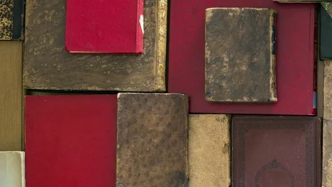 Close up top view of many old books. Pan Stock Footage 72170797