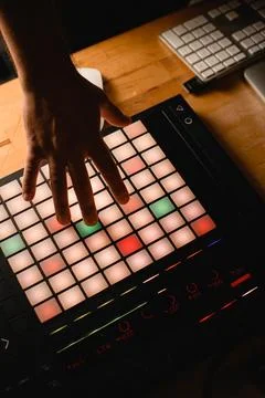 Close up top view of midi controller on wooden desktop, male hand pressing keys Fotos Stock
