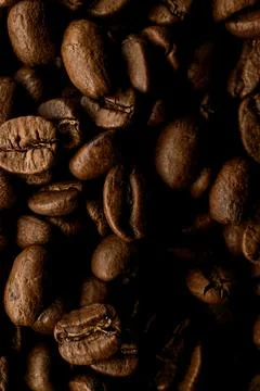 Close-up top view of mixture of aromatic dark roasted coffee beans. Stock Photos