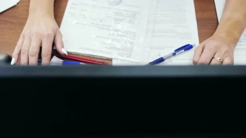 Close-up top view of office worker hands typing on computer keyboard Stock Footage 169367310