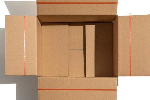 Close-up top view of an open cardboard box interior. Stock Photos