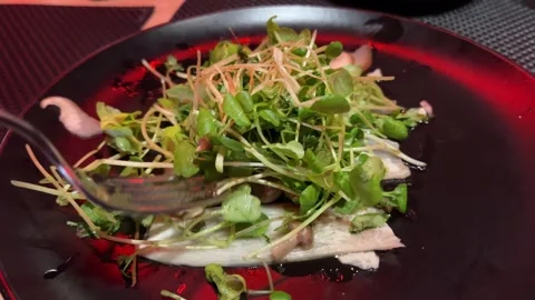 Close up top view of placing micro green on a vegetable dish in restaurant. Stock Footage 302268510