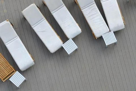 Close Up .Top view pool bed, beach chair on wooden plank floor Stock-Fotos