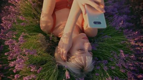 Close up top view portrait of young happy smiling girl posing, laying in Stock Footage 115740101