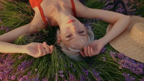 Close up top view portrait of young happy smiling girl posing, laying in Stock Footage 115822559
