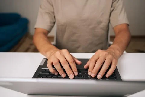 Close-up top view of programmer male hands typing code on laptop keyboard 스톡 사진
