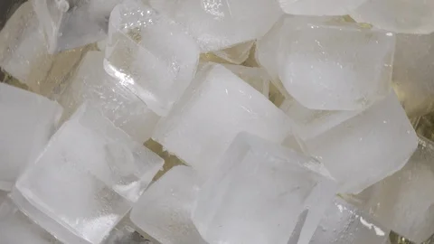 Close-up. Top  VIew of  Rotating ice cubes Video stock 124480848