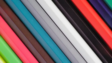 Close-Up, Top View, Row of Colored Pencils Slowly Rotate around Stock Footage 112624612