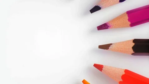Close-Up, Top View, Row of Colored Pencils Slowly Rotate to the Right On the Stock Footage 112625085