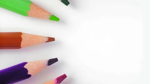 Close-Up, Top View, Row of Colored Pencils Slowly Rotate around the Circle Left Stock Footage 112625511