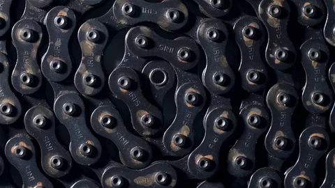 Close up top view of rusty dirty metal bicycle chain in circle shape rotating Stock Footage 71681295