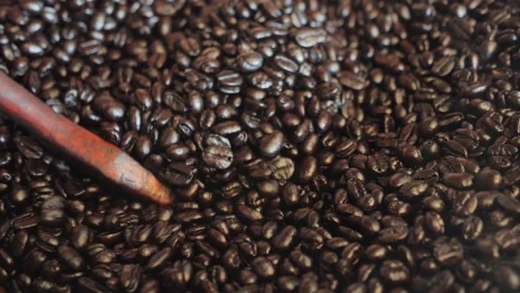 Close up top view of seeds coffee. Fragrant coffee beans are roasted in a frying Stock Footage 154013957