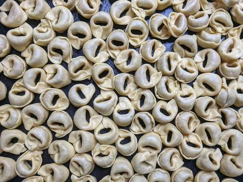 A close up top view shot of raw Tortellini with white mushrooms Texture Food Stock Photos