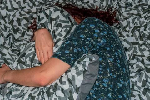 A close-up top view shot of an unrecognizable young Caucasian redhead woman l Stock Photos