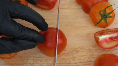 Close up Top-view, showing the method to chop tomato to be in a dice shape Видео 136820412